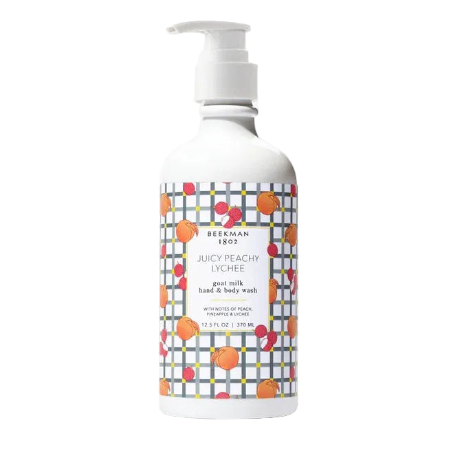 Bottle of Beekman 1802 Juicy Peachy Lychee goat milk hand & body wash on a white background