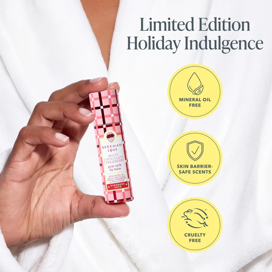 Hand holding the lip balm box with mineral oil-free, skin barrier-safe scents and cruelty-free badges