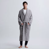 BAREFOOT DREAMS | CozyChic® Adult Robe — dove gray, A man wearing a plush, light gray terry cloth bathrobe with a tie belt, standing against a light gray studio background.