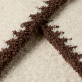 Close-up of the CozyChic Rib Blanket Stitch Throw fabric in Cream / Java