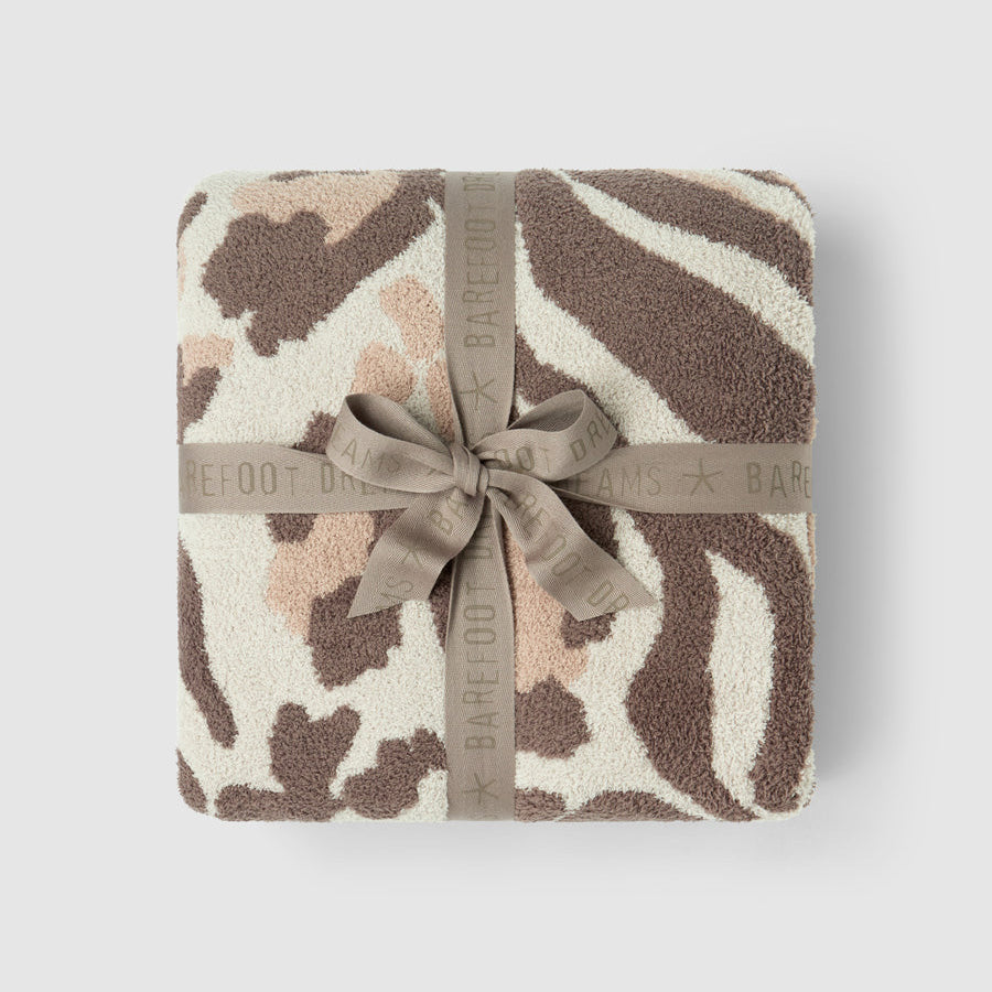 CozyChic Marbella Leopard Throw in Sandstone Multi, folded and tied with a ribbon bow