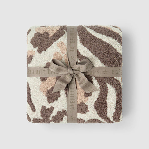 CozyChic Marbella Leopard Throw in Sandstone Multi, folded and tied with a ribbon bow