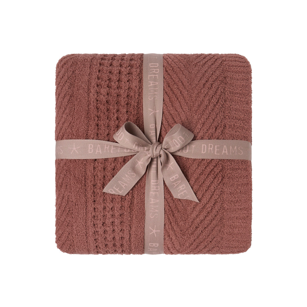 CozyChic Holiday Waffle Cable Throw in Faded Brick, folded and tied with a ribbon bow