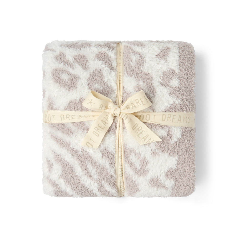 CozyChic Lush Knit Leopard Throw in Cream, folded and tied with a ribbon bow