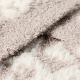 Close-up of the CozyChic Lush Knit Leopard Throw fabric in Cream