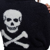 Close-up of the white skull and crossbones graphic on the black robe