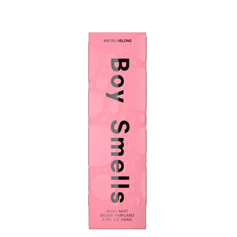 Pink packaging of 'Boy Smells' body mist with text on a white background