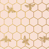 gold bees and honeycomb on a pale pink background