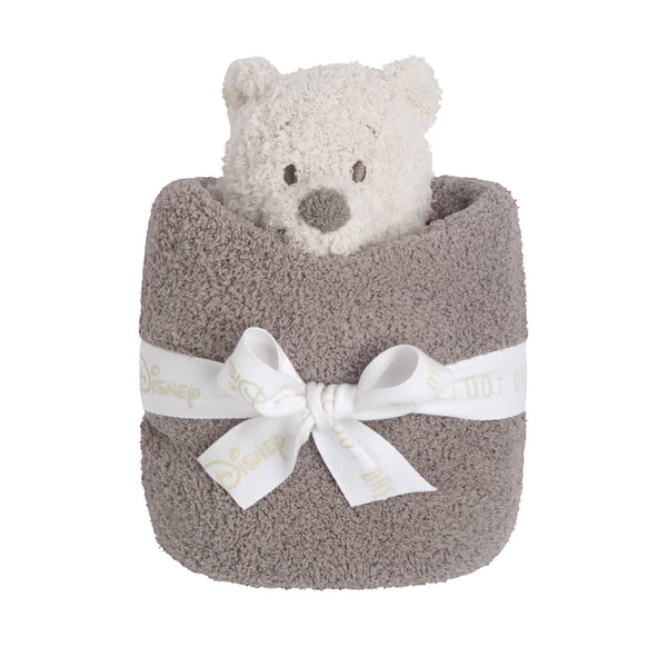 Winnie the Pooh Blanket Buddie rolled in its blanket and tied with a white ribbon