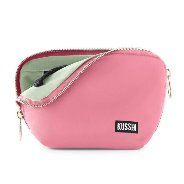 Sweat Pea Pink/Pistachio, Pink cosmetic bag with a gold zipper and 'Kusshi' brand logo on a white background