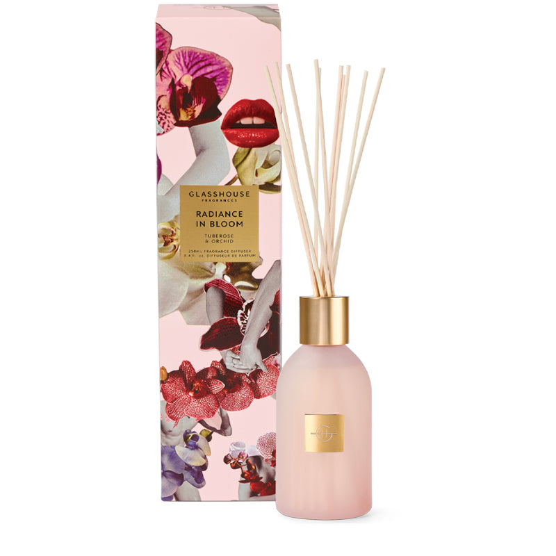 Diffuser bottle with floral packaging on a white background