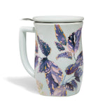 Tea mug with floral design and lid on a white background