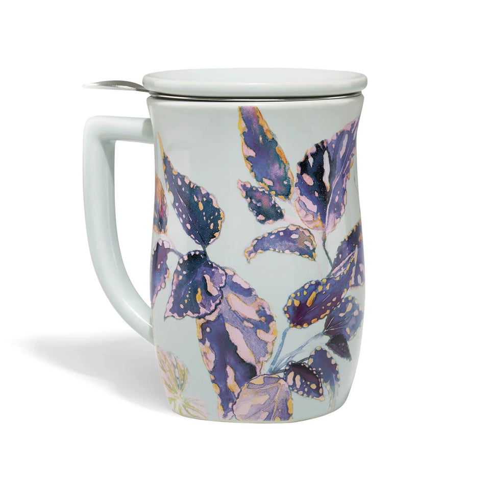Tea mug with floral design and lid on a white background