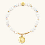 Reverse of the Prioritize Your Peace bracelet charm showing the dove