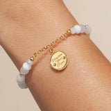 Prioritize Your Peace charm bracelet worn on a wrist