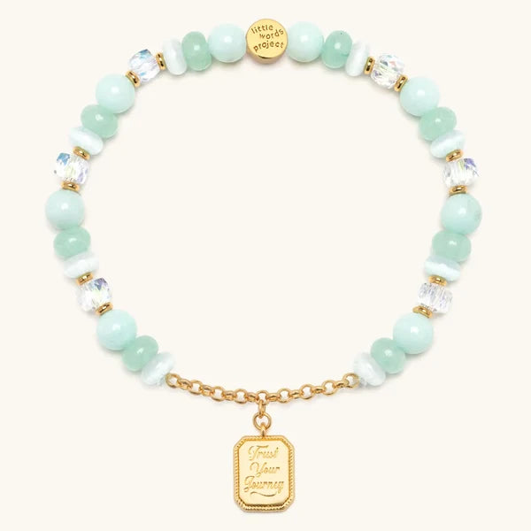 Trust Your Journey charm bracelet with seafoam beads and a gold medallion