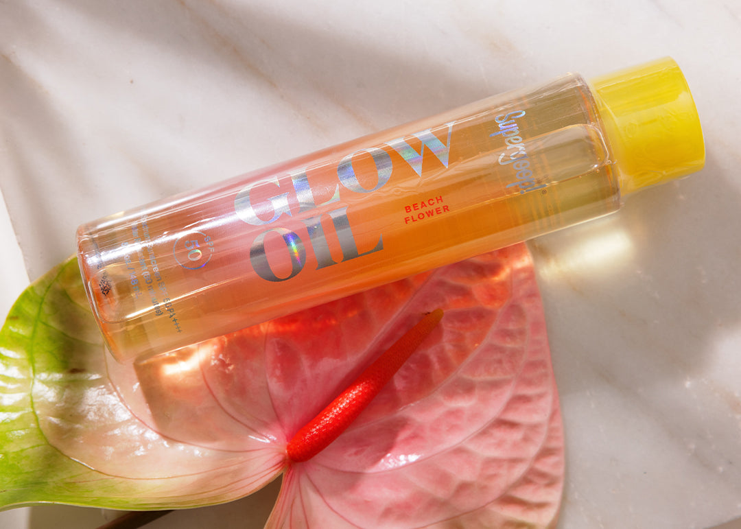 Clear bottle with yellow cap labeled 'SHAW OIL' on a textured surface