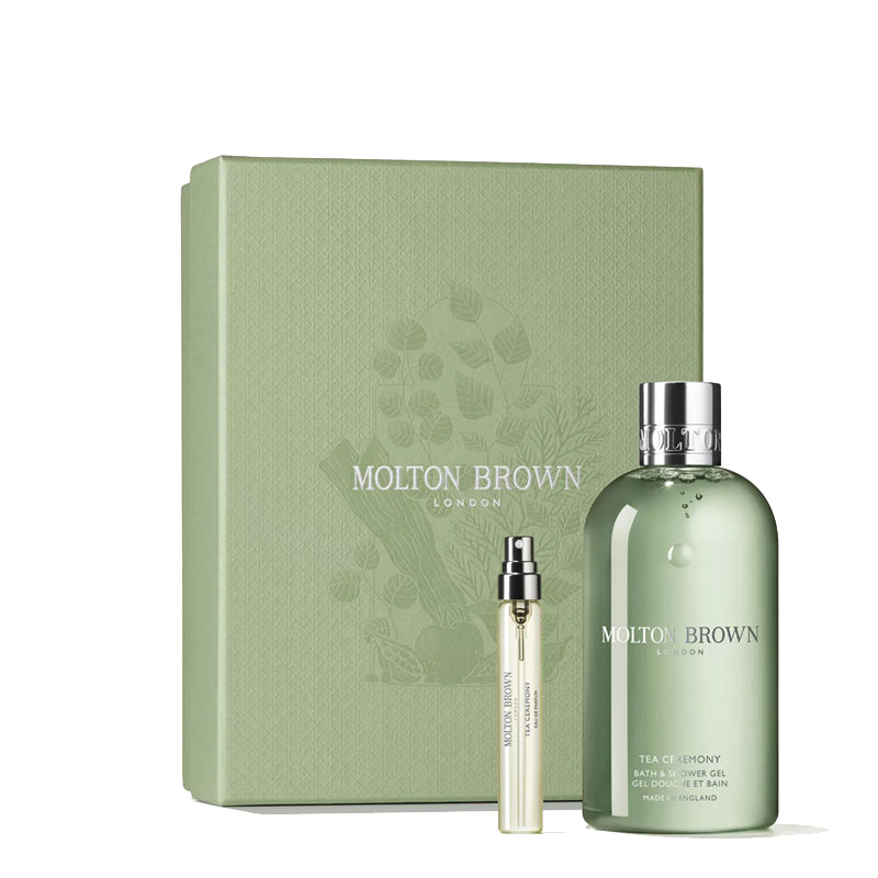 Molton Brown gift set with a large bottle, small bottle, and box on a white background