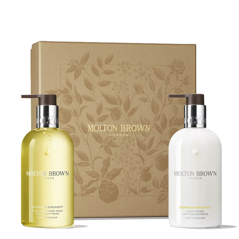 Molton Brown hand wash and lotion set with decorative box on a white background