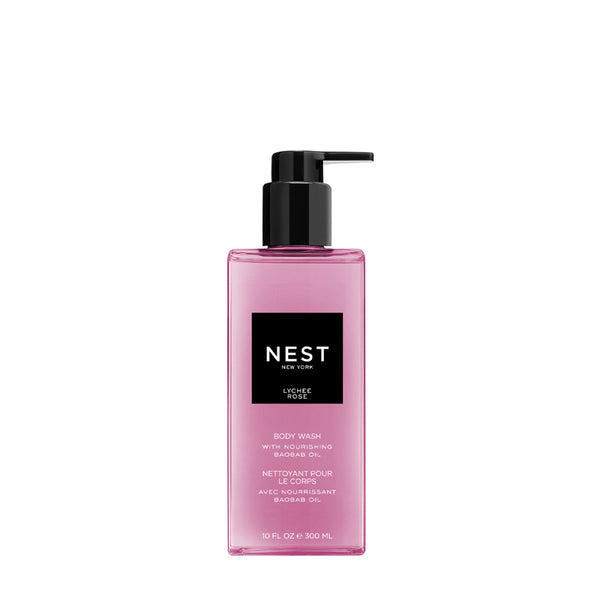Pink bottle of NEST body wash with pump on a white background