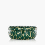 Decorative green container with gold patterns on a white background