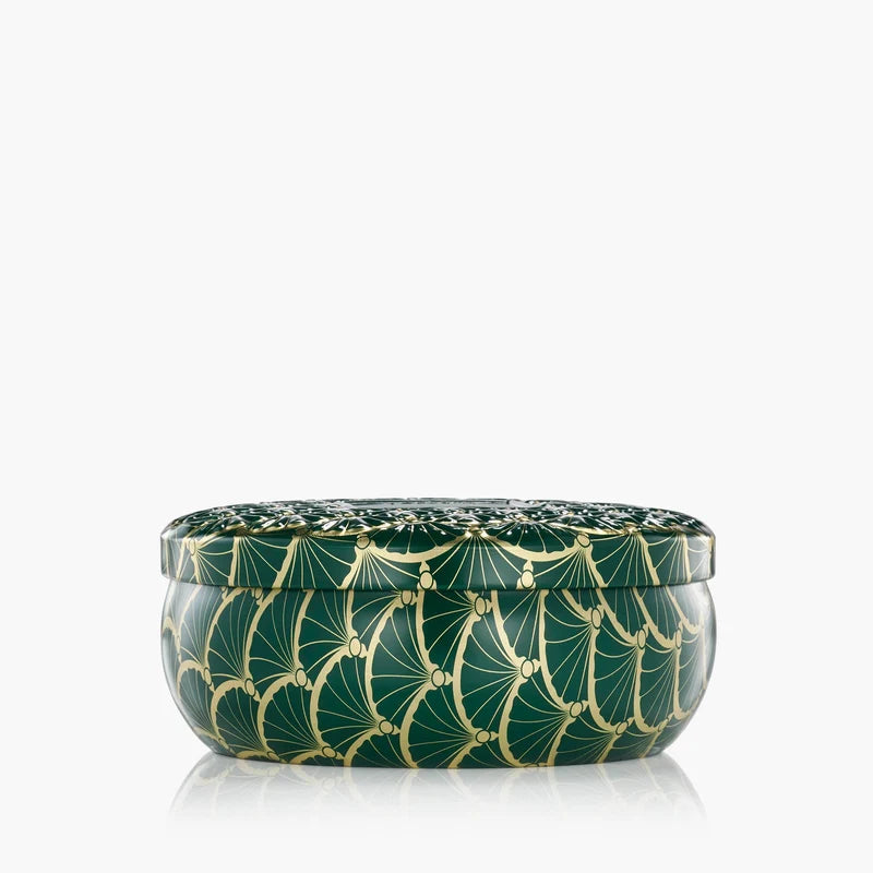 Decorative green container with gold patterns on a white background
