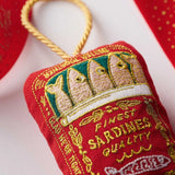 embroidered sardine tin on fabric