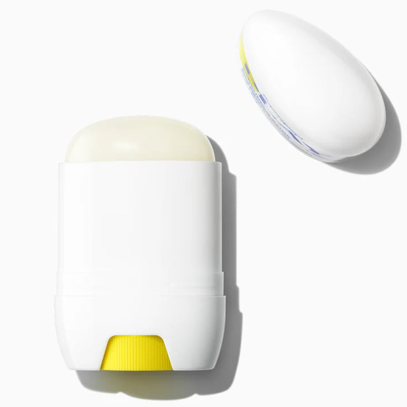 White and yellow skincare product on a white background