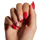 Hand with red and pink nail polish on a white background