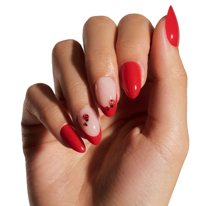 Hand with red and pink nail polish on a white background