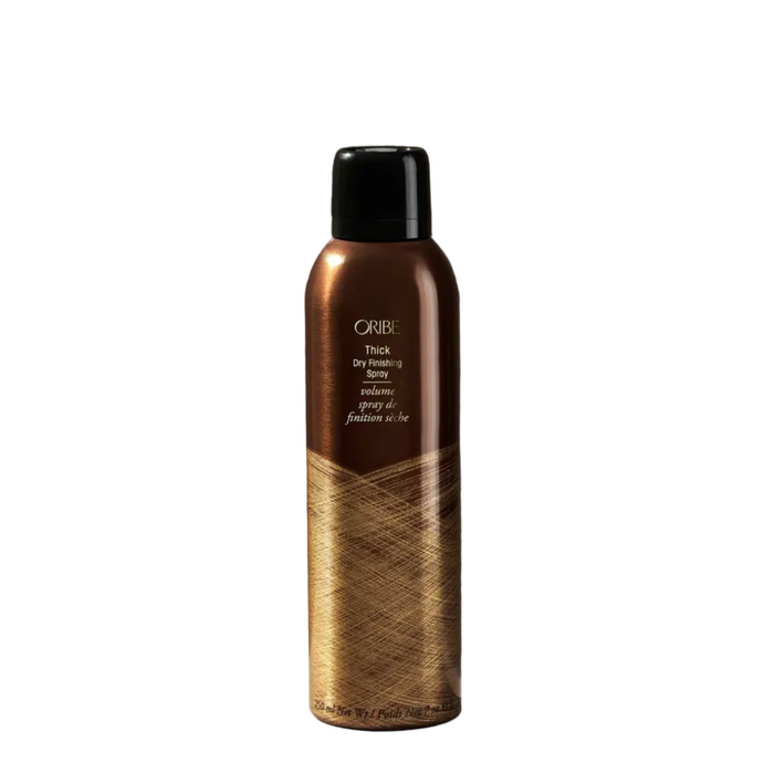 Oribe hair product bottle on a dark background