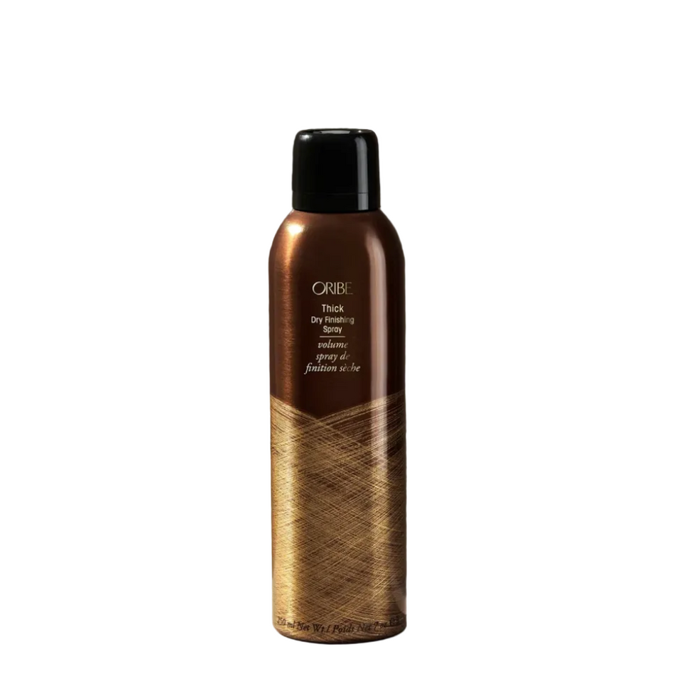 Oribe hair product bottle on a dark background