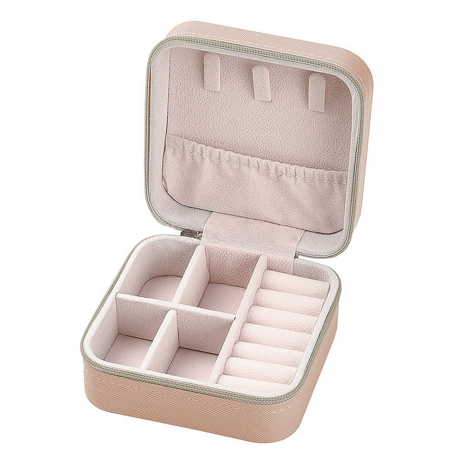 Ivory travel jewelry box with compartments, open to show storage sections and organizer pockets