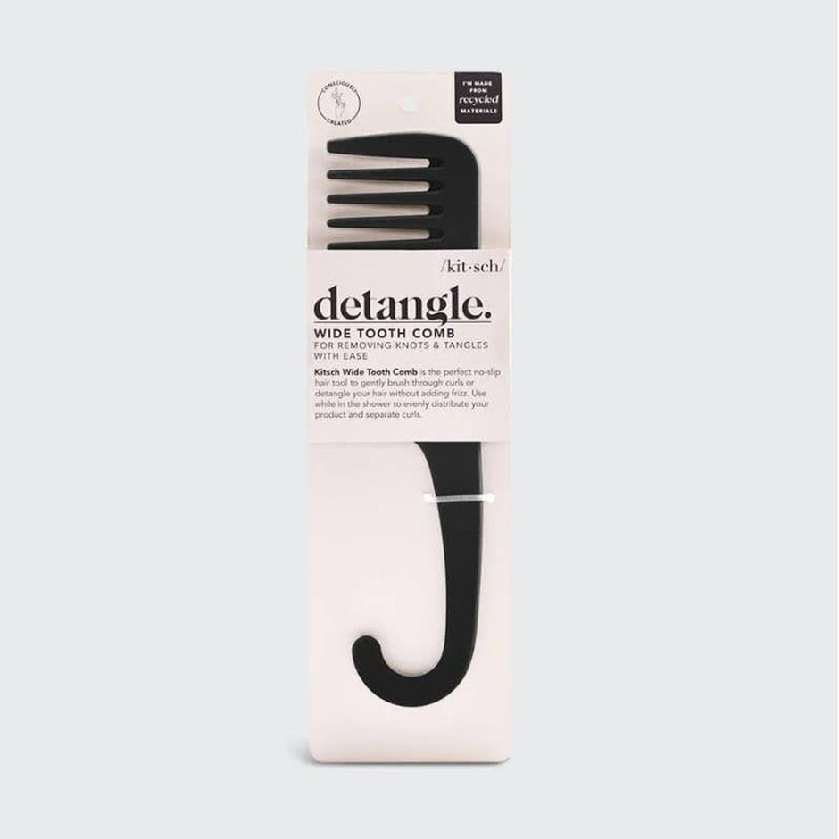 Kitsch Detangle Wide Tooth Comb in black with packaging on neutral background