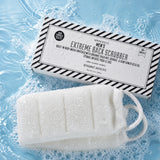 Spongellé Men's Extreme Back Scrubber sponge in soapy water with packaging displayed
