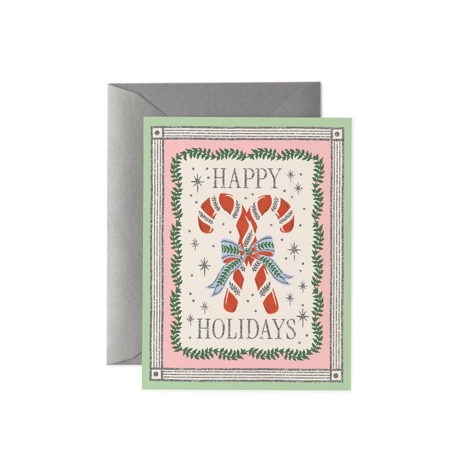 Rifle Paper Co. Happy Holidays greeting card with candy cane design and green envelope