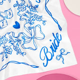 White bride hair scarf with blue floral and bow designs for bachelorette and wedding