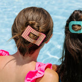 TELETIES Summer Crush hair clip worn in updo by girl at pool in striped pink and yellow design