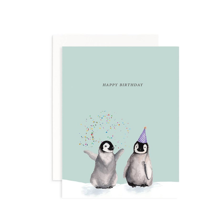 Birthday card with two penguins and confetti on a light blue background