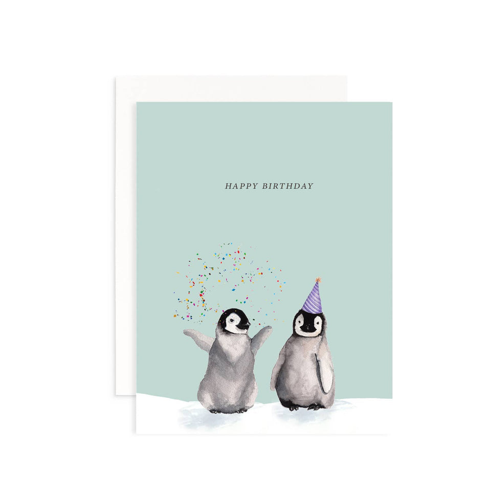 Birthday card with two penguins and confetti on a light blue background
