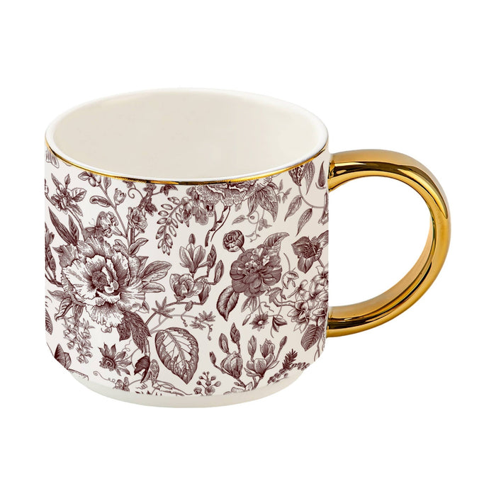 Brown Delft ceramic coffee mug with floral pattern and gold handle on white background