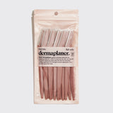 Packaged dermaplaner with clear plastic cover on a light gray background