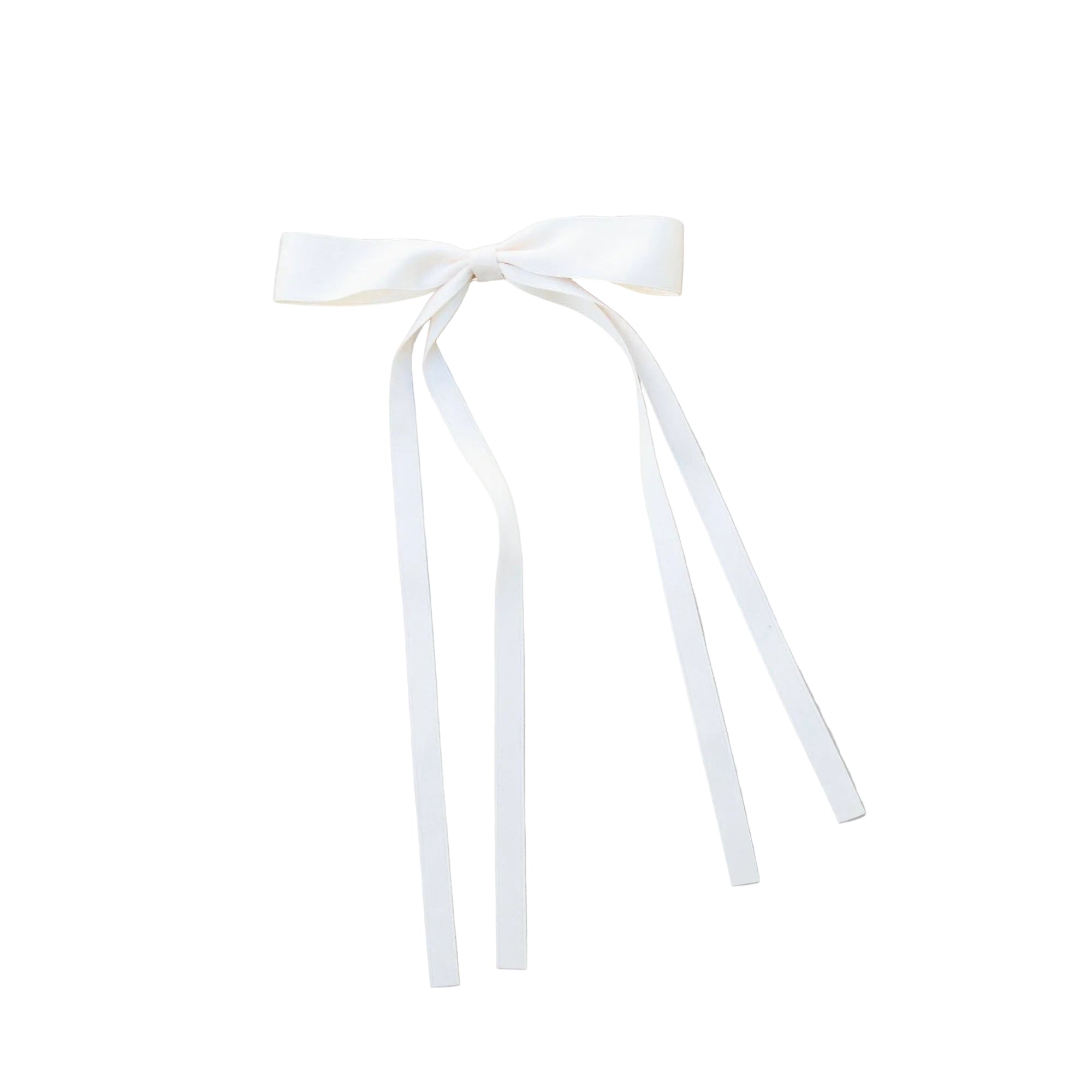 Cream colored girlie bow with long ribbon tails on neutral background