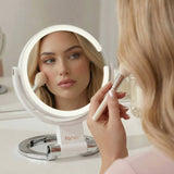 Woman using FANCII Sadie LED lighted magnifying mirror for makeup application and skincare routine