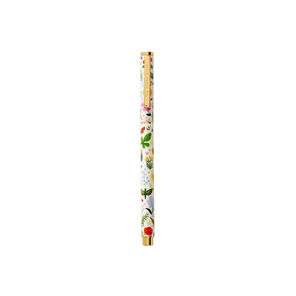 Rifle Paper Co. Curio Pen with floral design and gold accents on white background