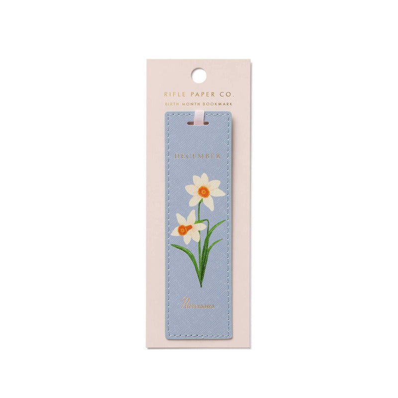 Rifle Paper Co. December birth month bookmark with white daffodil flowers on light blue leather
