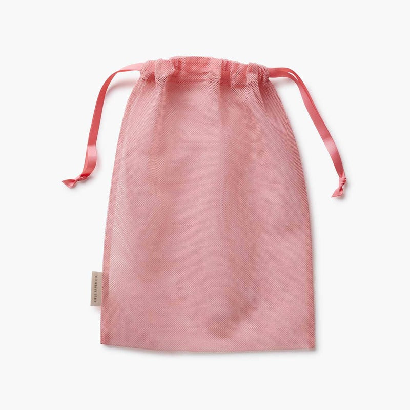 Pink Rifle Paper Co. Dahlia packing cube with drawstring handles on white background