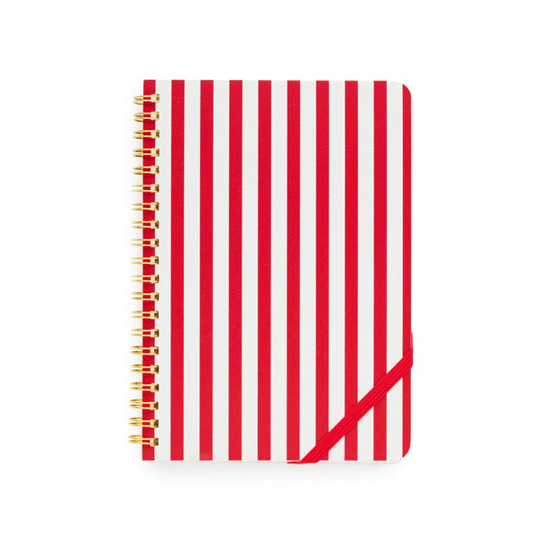 Red and white striped spiral notebook with gold binding on white background