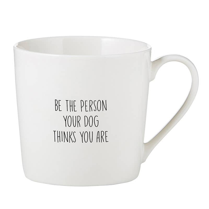 White ceramic cafe mug with 'Be the Person Your Dog Thinks You Are' text