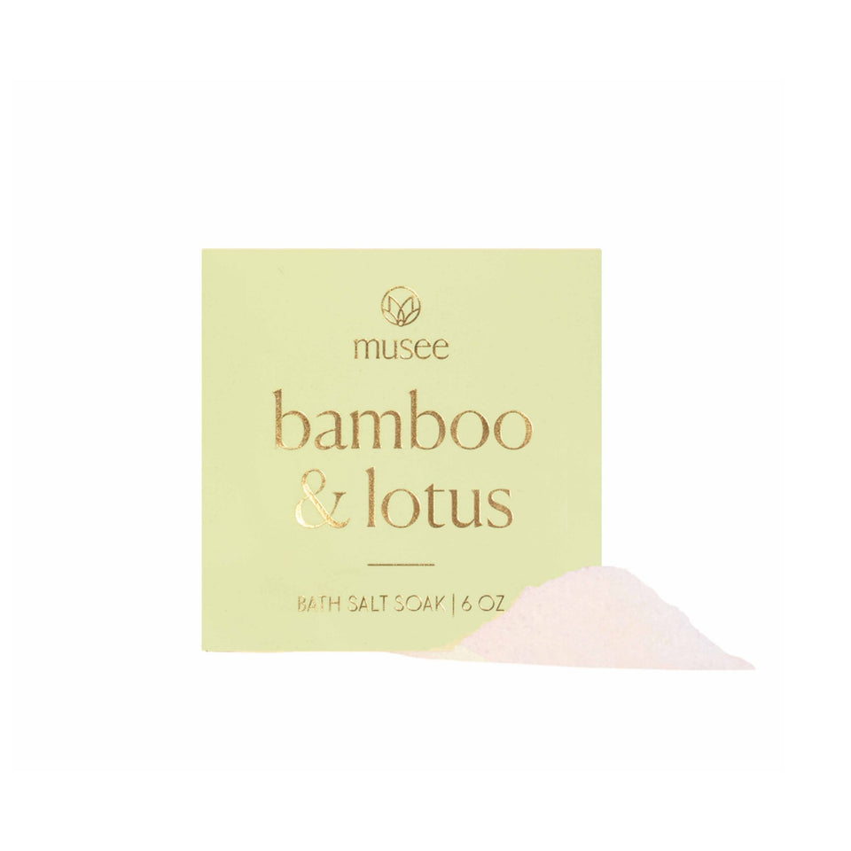 Musee Bamboo & Lotus Bath Salt Soak 6 oz package with white salt crystals on pale yellow background